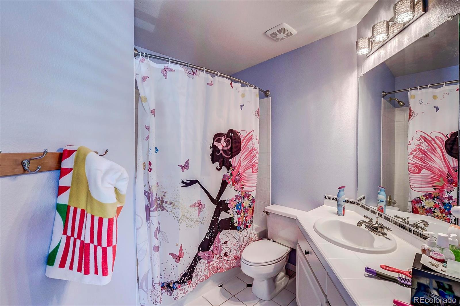 9847 Spring Hill Lane Highlands Ranch, CO 80129 - Photo 33 of 33 a bathroom with a sink toilet and shower