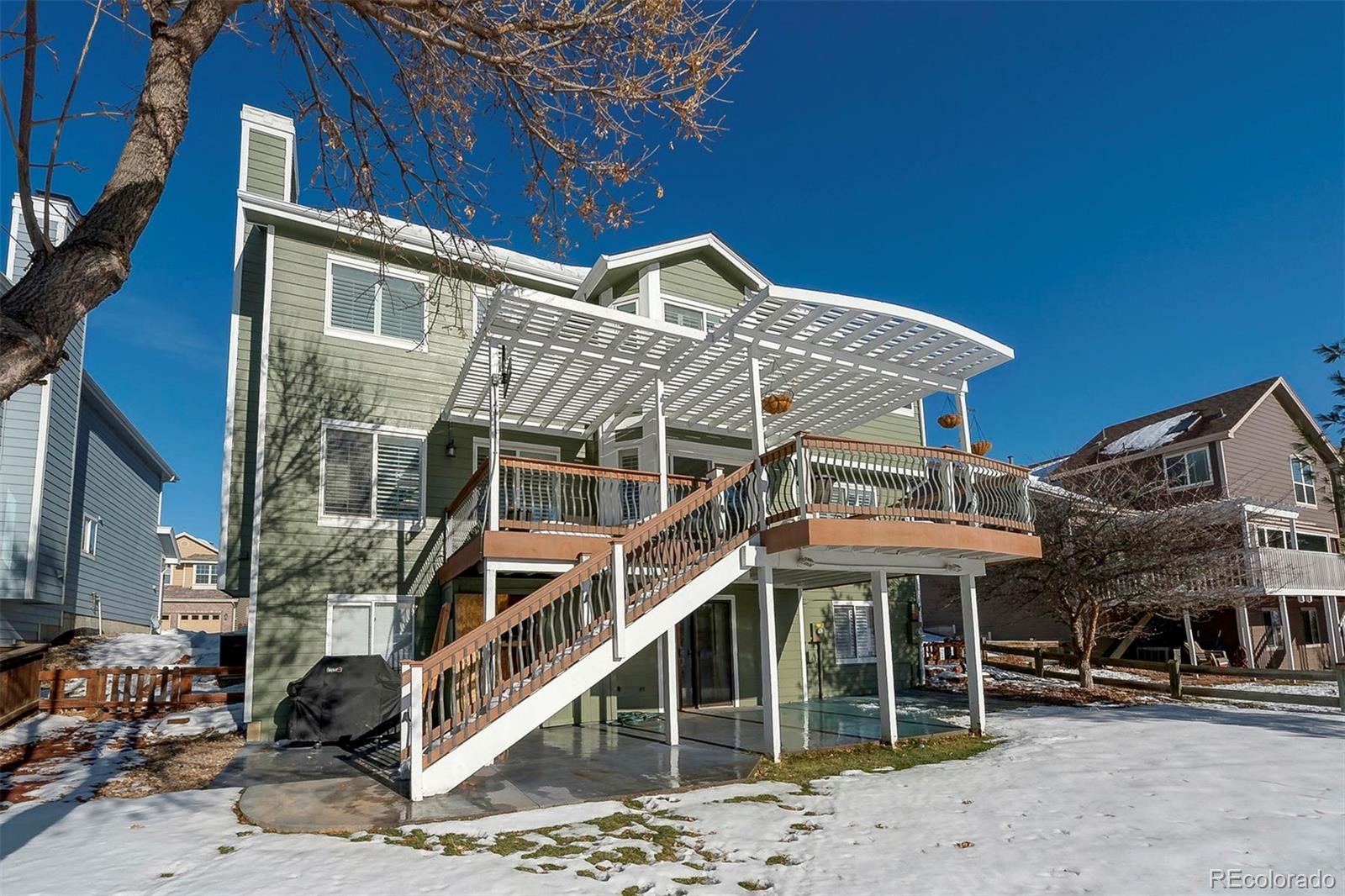 9847 Spring Hill Lane Highlands Ranch, CO 80129 - Photo 5 of 33 a front view of a building with balcony