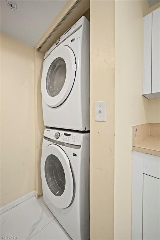 1820 Florida Club Circle, Unit 2103 Naples, FL 34112 - Photo 15 of 22 a utility room with dryer and washer