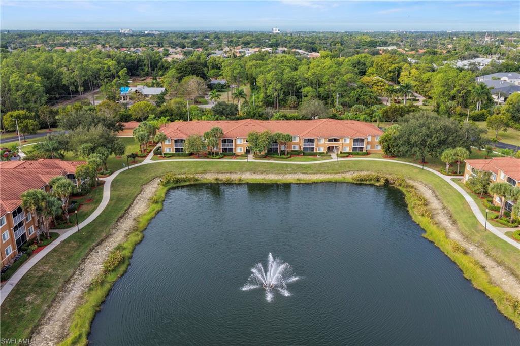1820 Florida Club Circle, Unit 2103 Naples, FL 34112 - Photo 18 of 22 an aerial view of a house with a swimming pool yard and outdoor seating