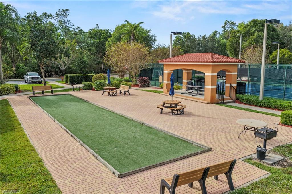 1820 Florida Club Circle, Unit 2103 Naples, FL 34112 - Photo 21 of 22 a view of a house with swimming pool and sitting area