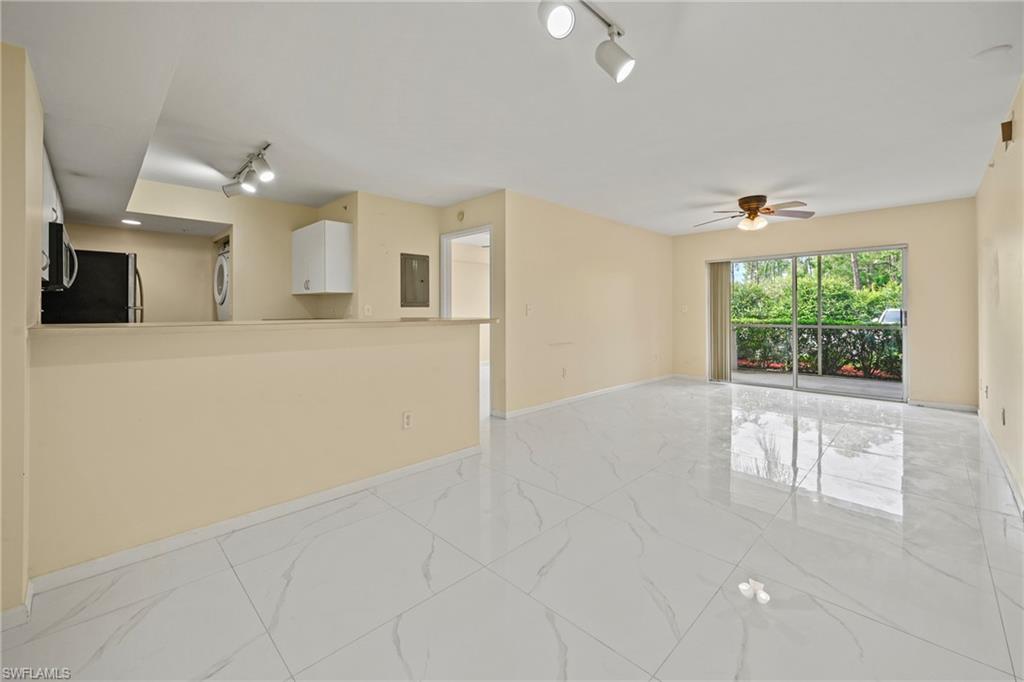1820 Florida Club Circle, Unit 2103 Naples, FL 34112 - Photo 3 of 22 a view of an empty room with a window