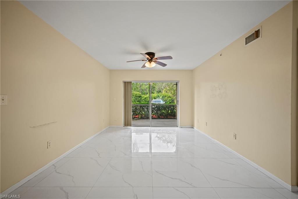 1820 Florida Club Circle, Unit 2103 Naples, FL 34112 - Photo 8 of 22 an empty room with a window
