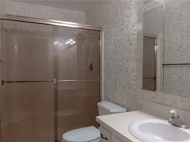 a bathroom with a toilet and a sink