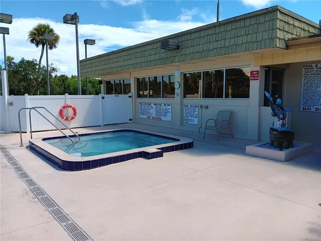 a view of a backyard with sitting area