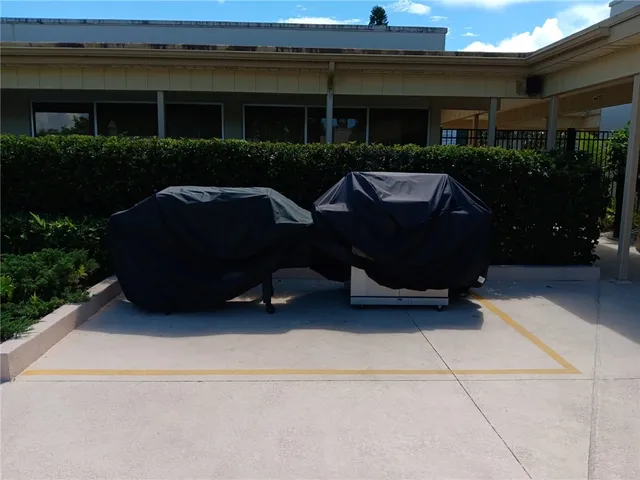 a couple of chairs sitting in front of building