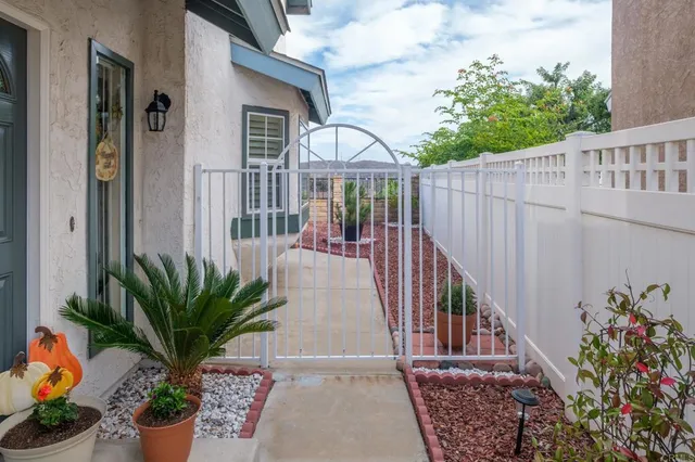 a view of a house with a flower garden
