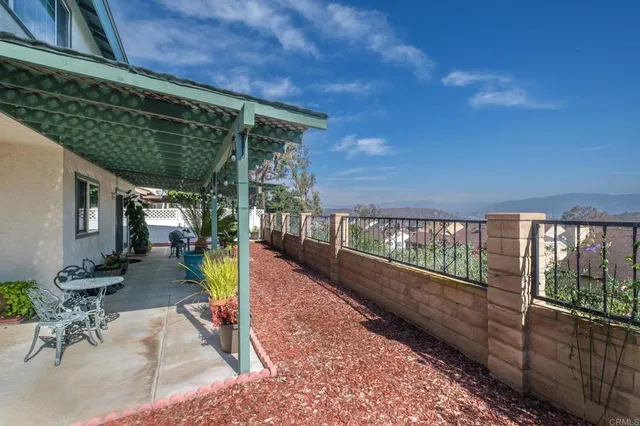 a view of a backyard with sitting area