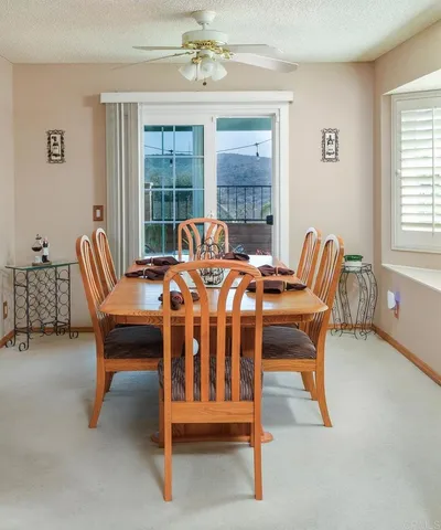a dining room with furniture and window