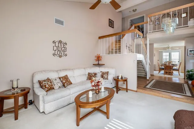 a living room with furniture and a table