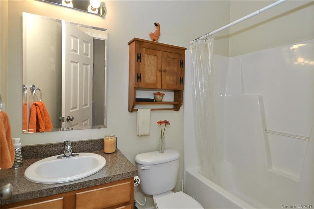 52 Rita Lane Canton, NC 28716 - Photo 14 of 19 a bathroom with a granite countertop sink toilet and shower
