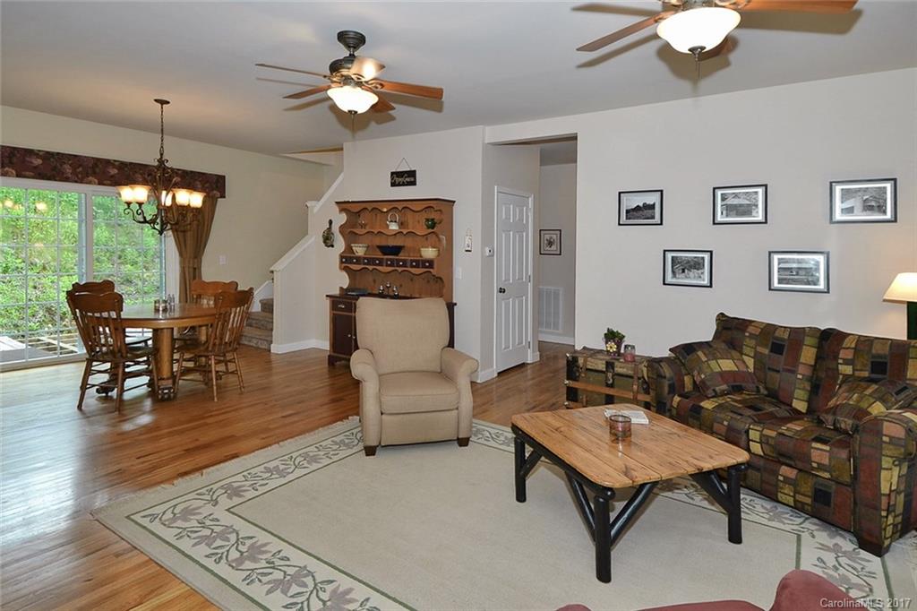 52 Rita Lane Canton, NC 28716 - Photo 5 of 19 a living room with furniture a chandelier and a table