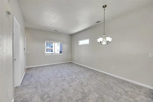 a view of living room with furniture and a window