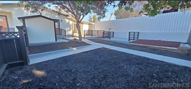 a view of backyard and tree