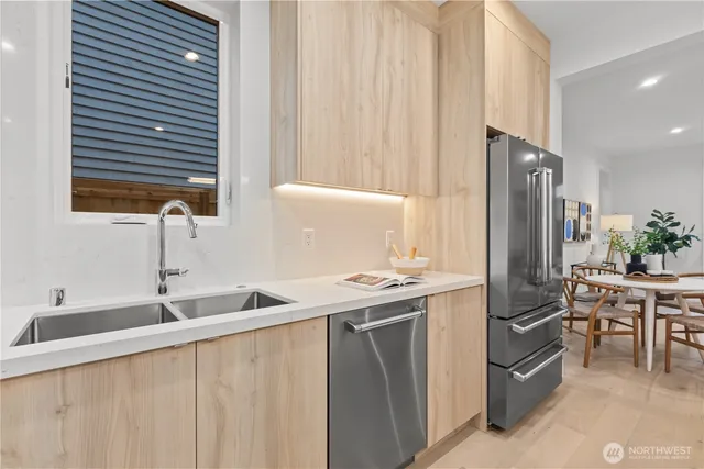 a kitchen with a stove and white cabinets