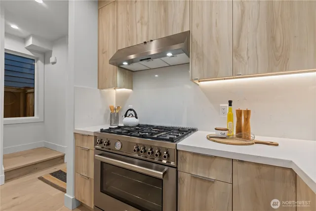 a kitchen with a stove and a sink