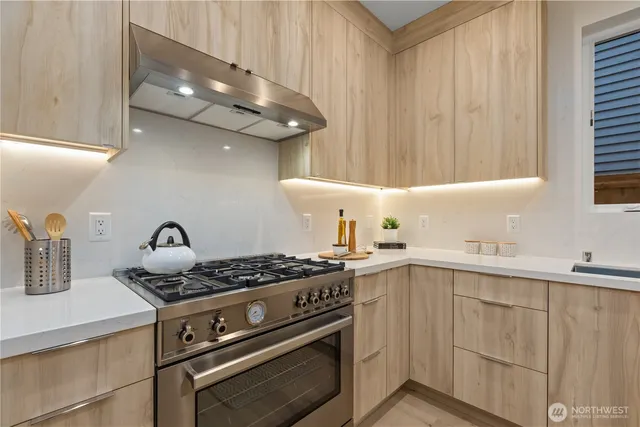 a bathroom with a toilet a sink and a window