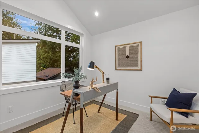 a view of a workspace with furniture