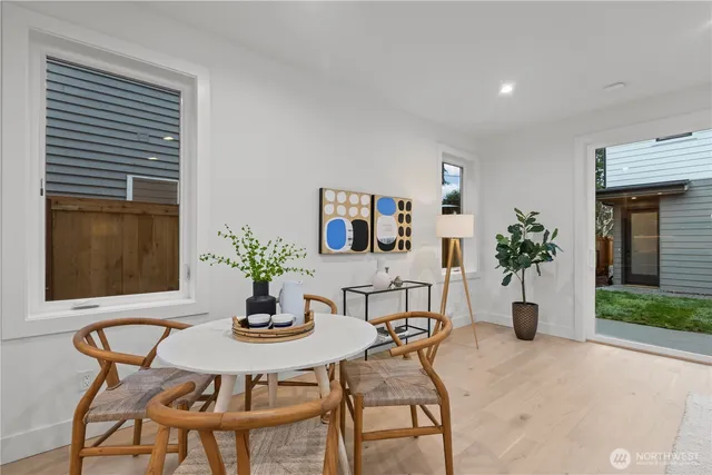 a dining room with furniture and window