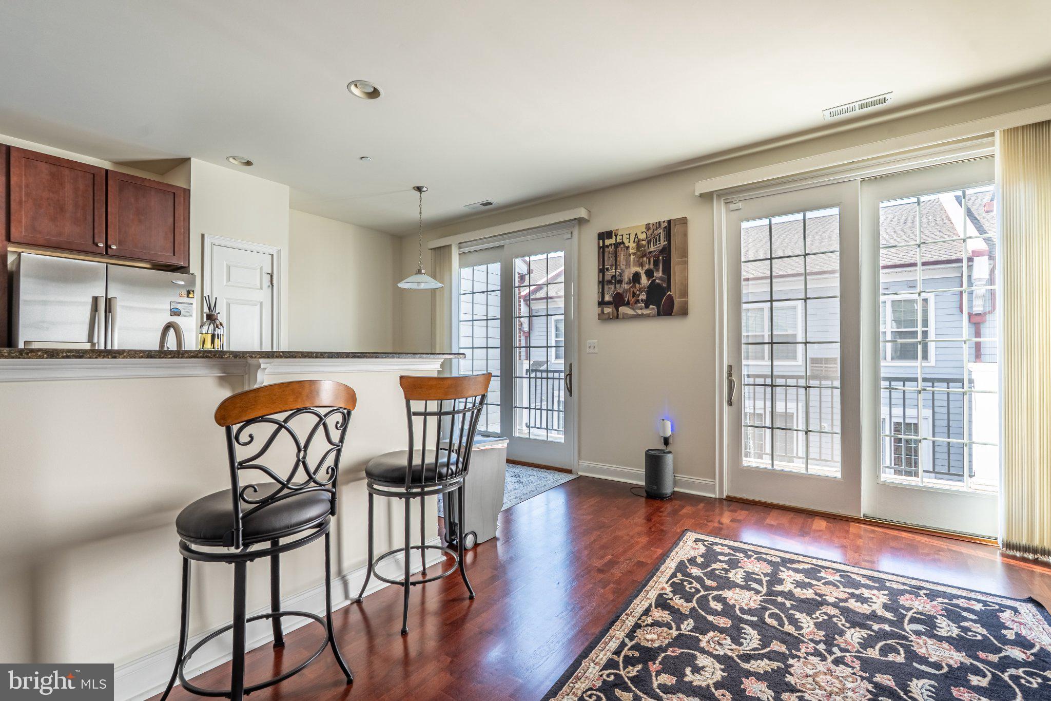 608 Captains Way Philadelphia, PA 19146 - Photo 13 of 36 a view of a dining room with furniture window and wooden floor