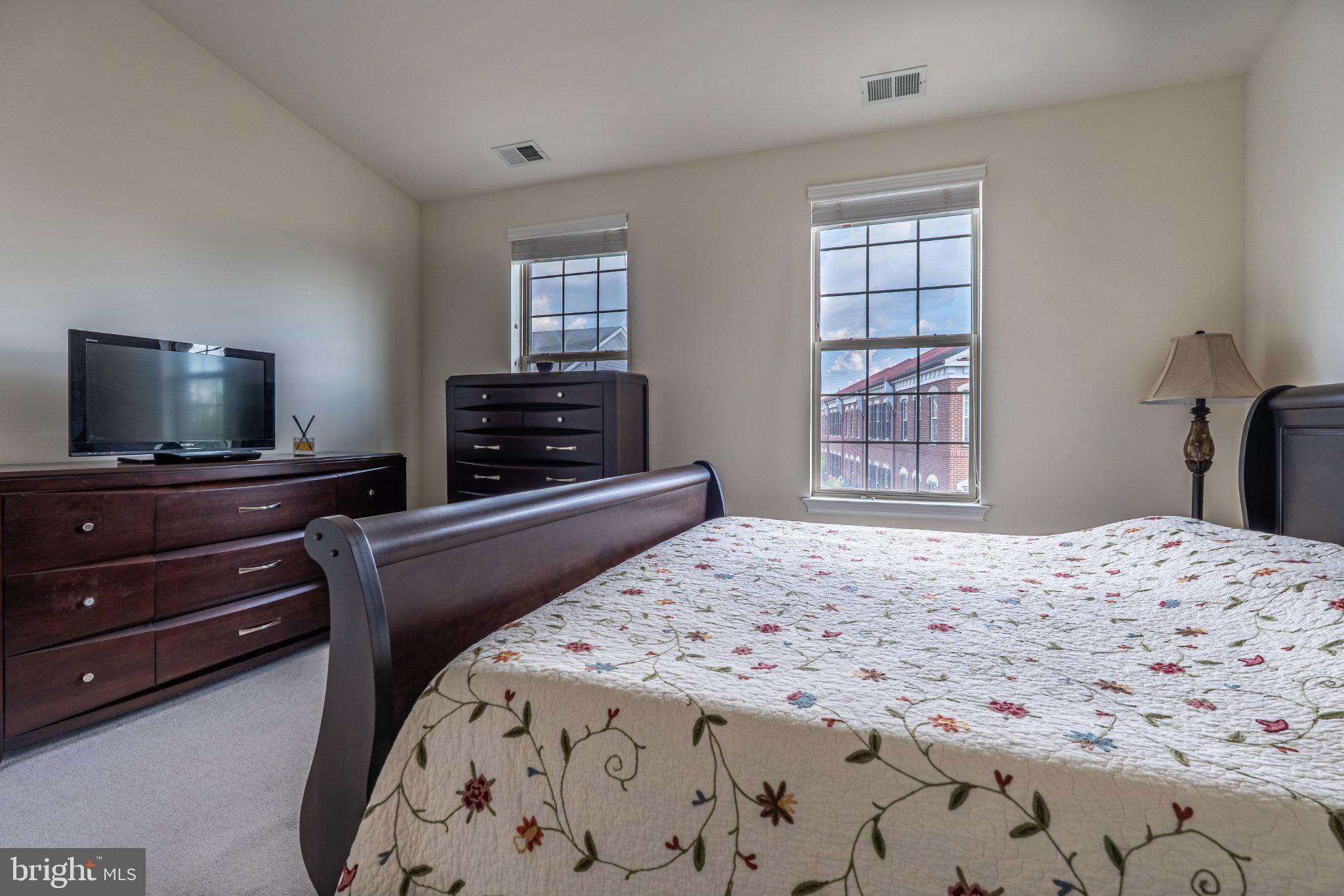 608 Captains Way Philadelphia, PA 19146 - Photo 21 of 36 a bedroom with a bed and a flat screen tv