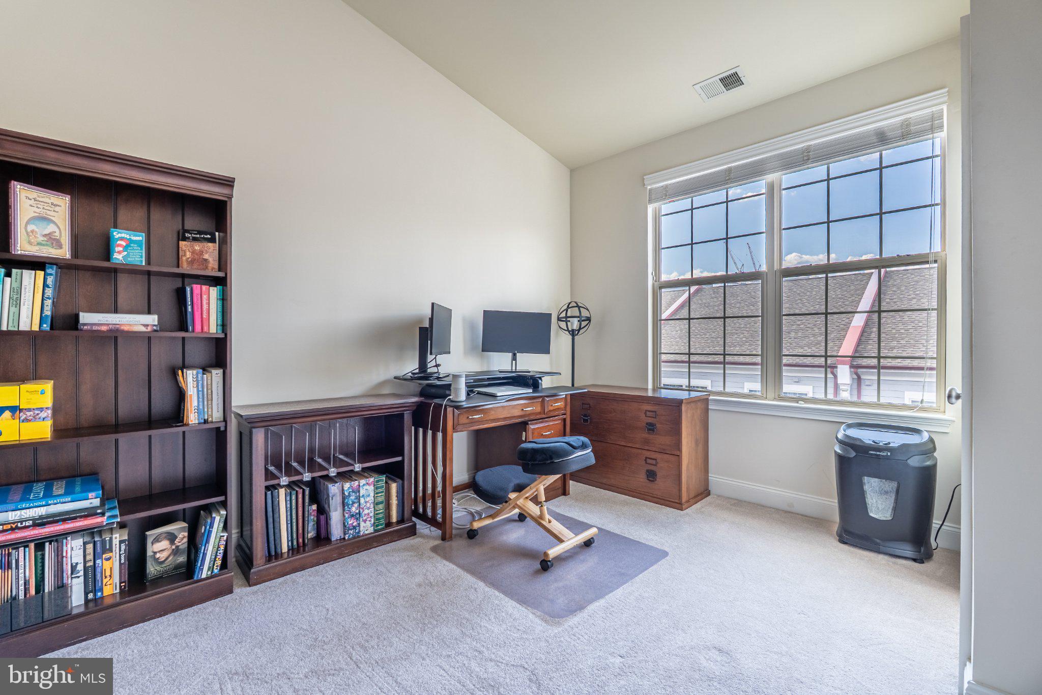 608 Captains Way Philadelphia, PA 19146 - Photo 26 of 36 a view of a workspace with furniture and a bookshelf