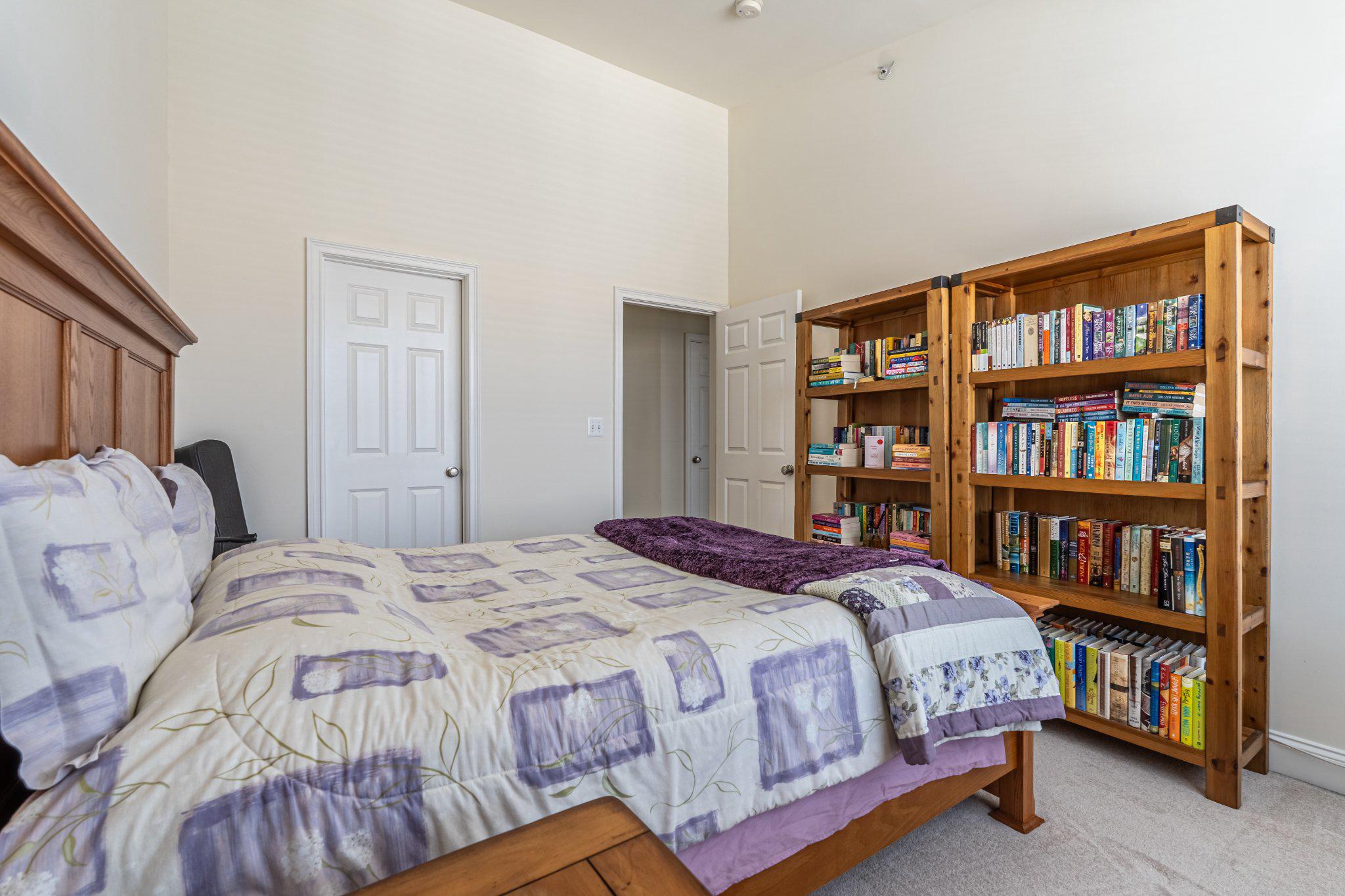 608 Captains Way Philadelphia, PA 19146 - Photo 29 of 36 a bedroom with a bed and a book shelf