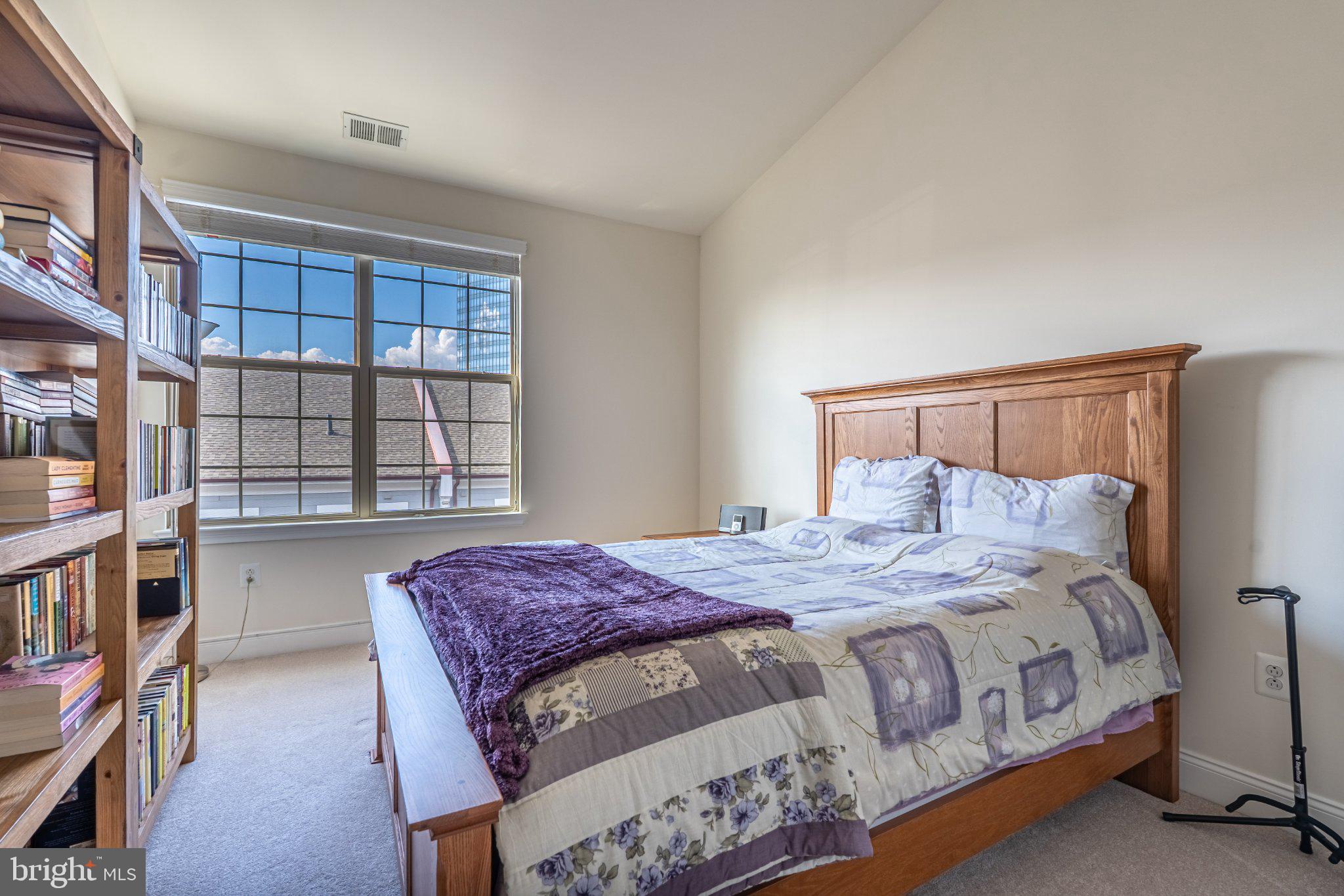 608 Captains Way Philadelphia, PA 19146 - Photo 31 of 36 a bedroom with a bed next to a large window
