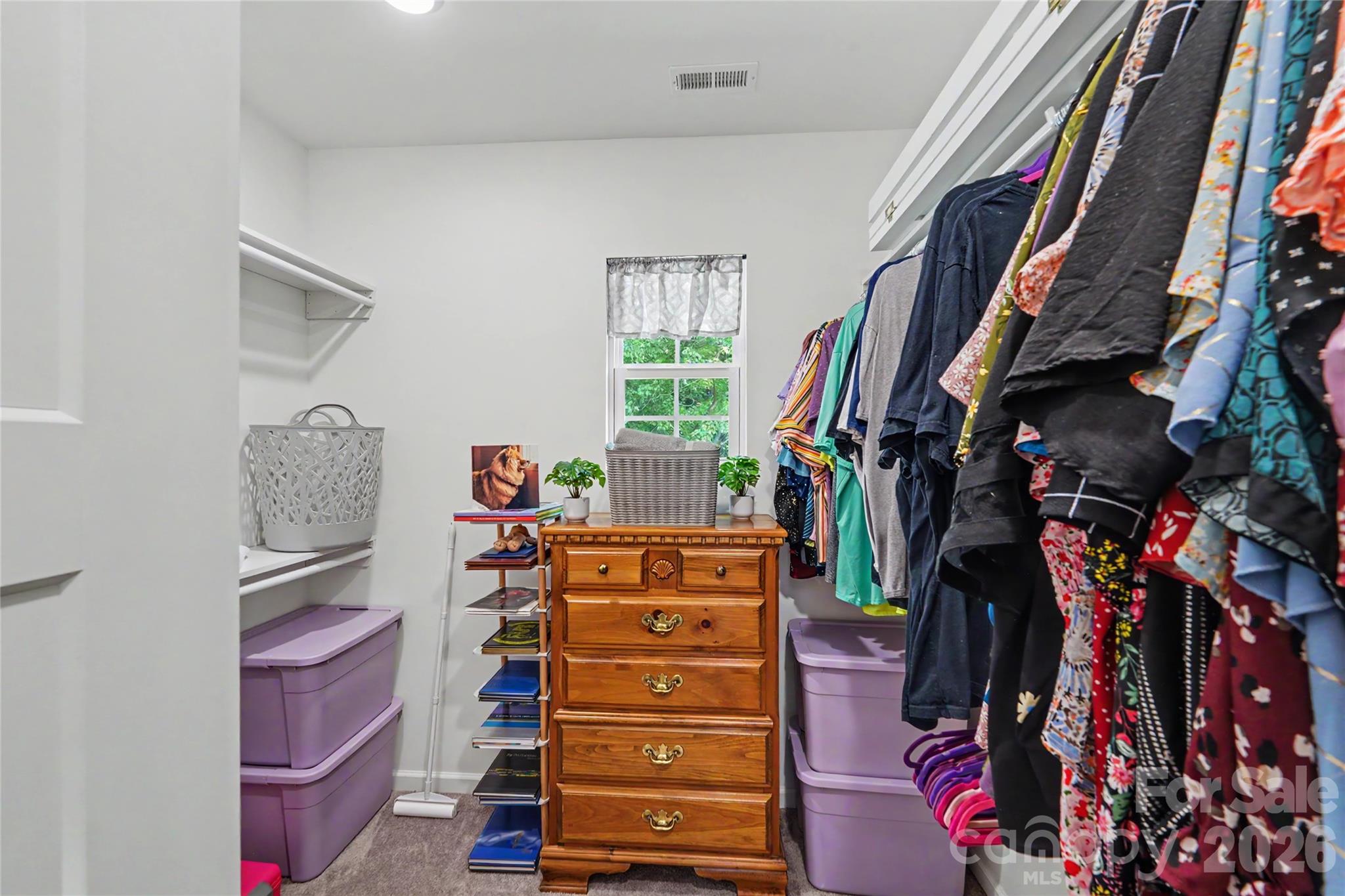 119 Brown Street Clover, SC 29710 - Photo 20 of 24 a view of walk in closet with clothes and shoes