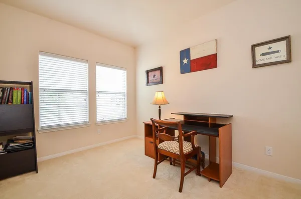 a workspace with furniture and a window
