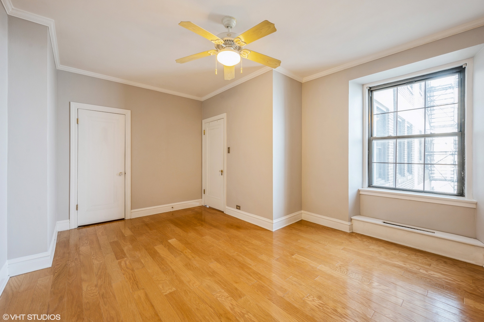 6101 North Sheridan Road, Unit 10G Chicago, IL 60660 - Photo 6 of 10 a view of an empty room with window and a kitchen