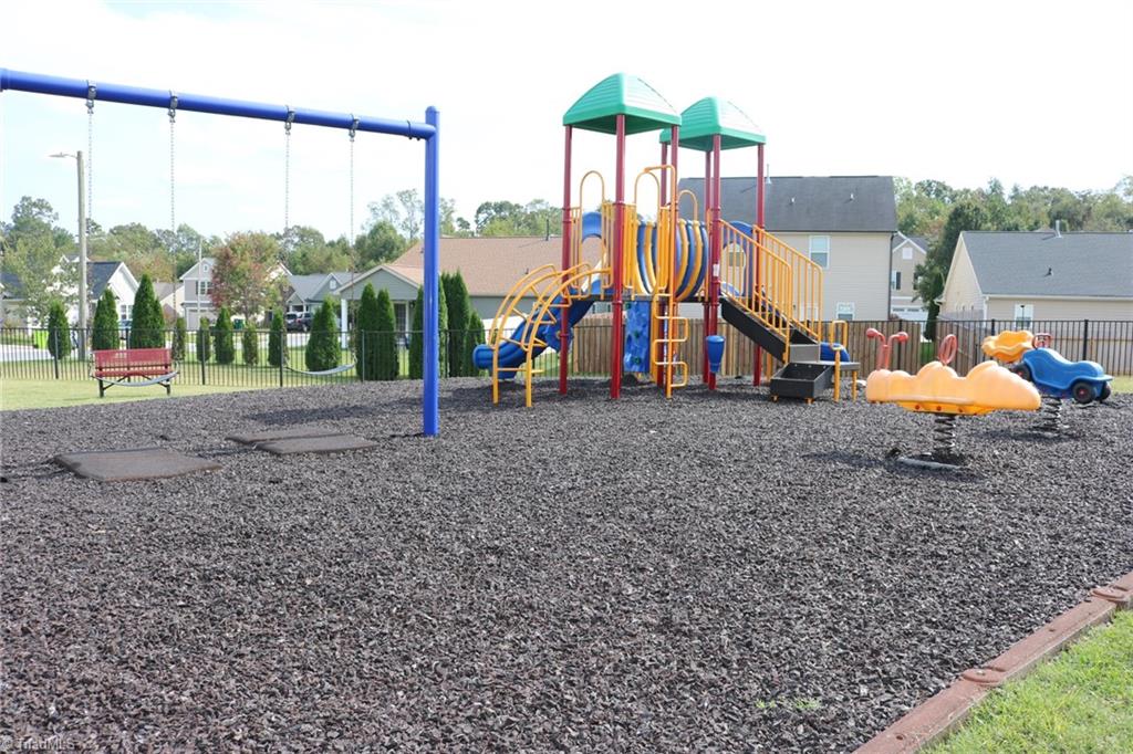 4547 Silo Ridge Clemmons, NC 27012 - Photo 32 of 37 Community playground with rubber mulch