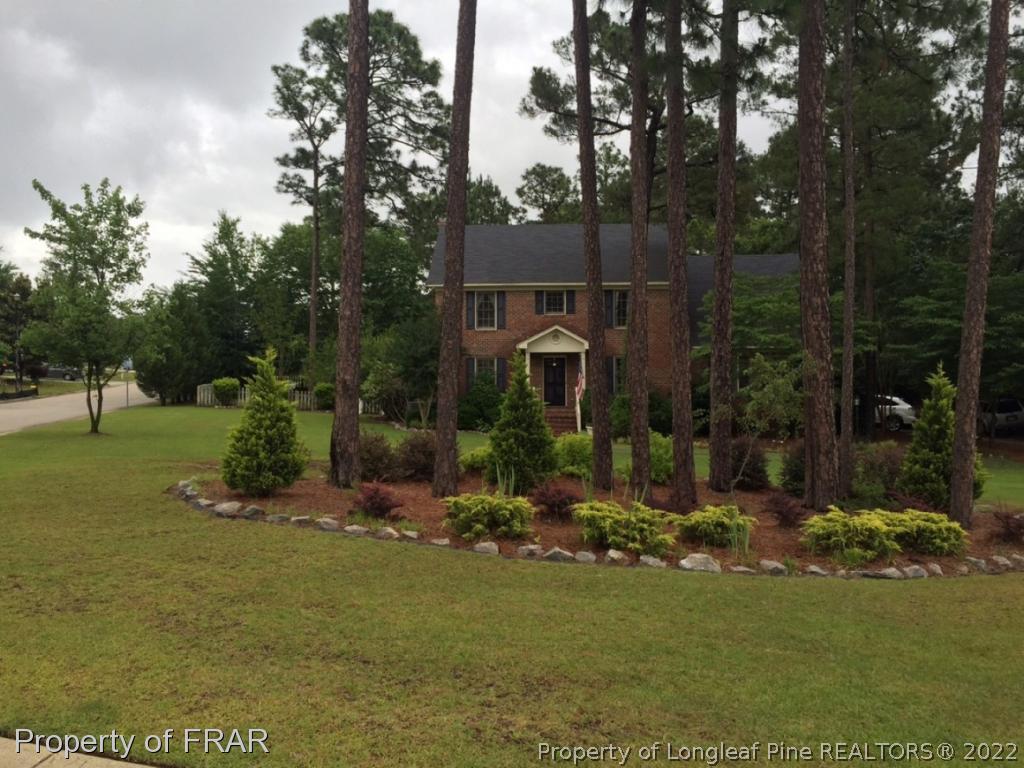 6250 Kirkwall Road Fayetteville, NC 28311 - Photo 1 of 16 a front view of a house with a yard