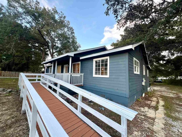 a view of a house with a roof deck