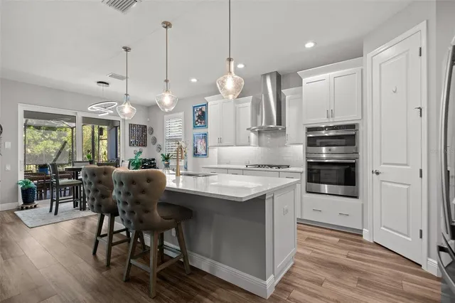 a bedroom with a bed and flat screen tv