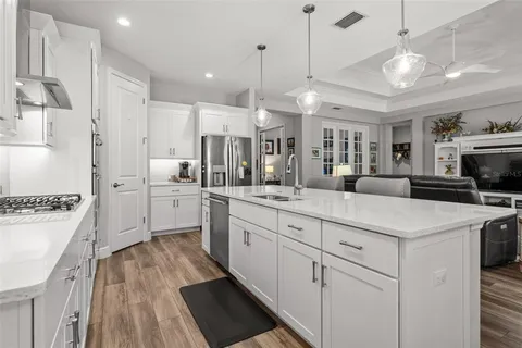 a view of walk in closet with clothes