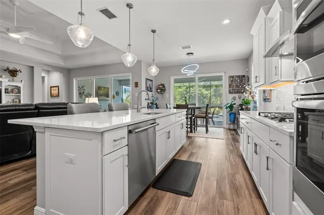 a bathroom with a sink mirror and shower