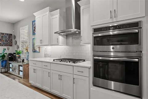 a bathroom with a sink mirror and shower