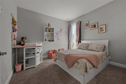 a view of a house with backyard and porch