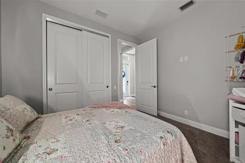 a view of a swimming pool with a table and chairs under an umbrella