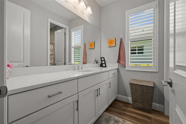 a view of a house with a small yard and a garden