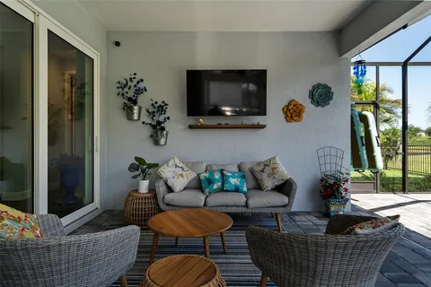 an aerial view of a house with a swimming pool yard and outdoor seating