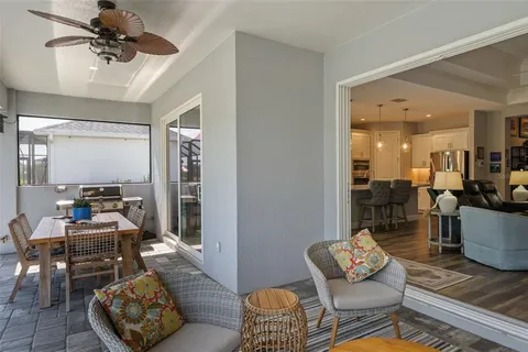 an aerial view of a house with outdoor space and lake view