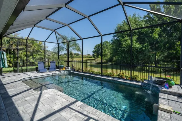 an aerial view of a swimming pool and outdoor space