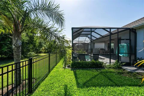 an aerial view of a house with swimming pool and outdoor space