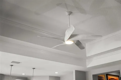 a spacious bedroom with a bed and a window