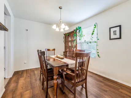 a large kitchen with granite countertop lots of counter space and stainless steel appliances