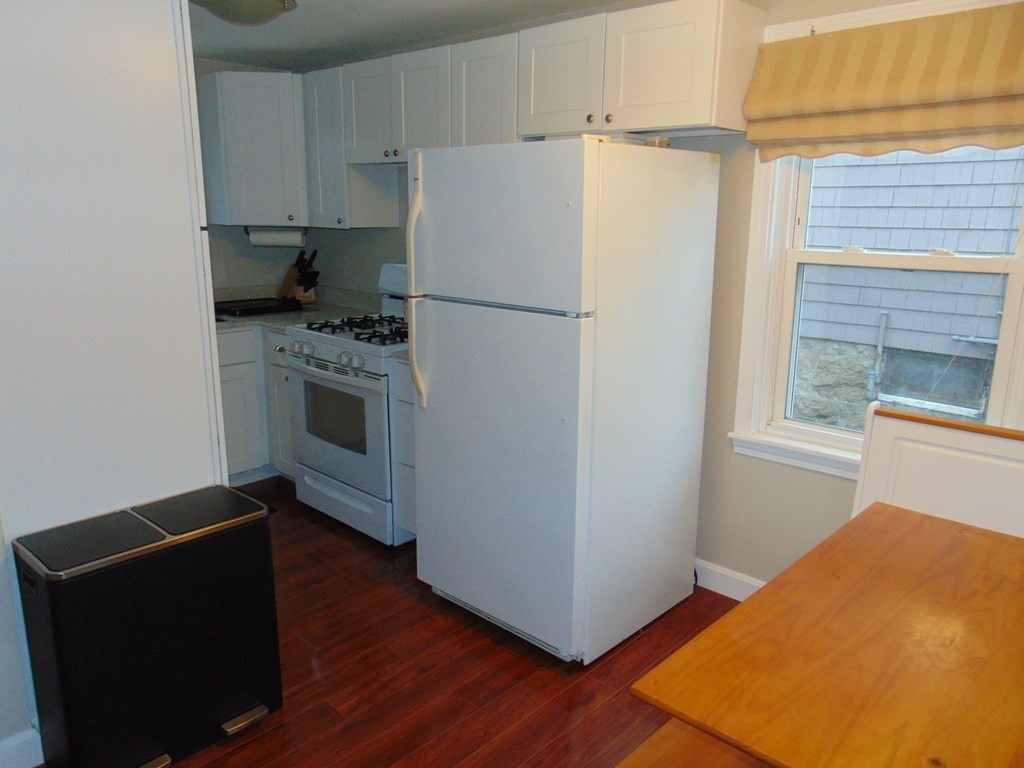 312 Anthony Fall River Fall River, MA 02721 - Photo 12 of 19 a kitchen with stainless steel appliances a refrigerator and a stove