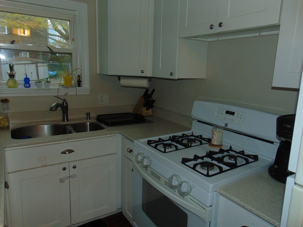 312 Anthony Fall River Fall River, MA 02721 - Photo 13 of 19 a kitchen with a stove and a sink