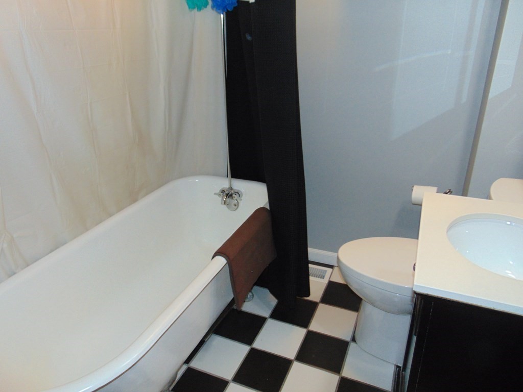 312 Anthony Fall River Fall River, MA 02721 - Photo 17 of 19 a bathroom with a sink a toilet a shower and a mirror